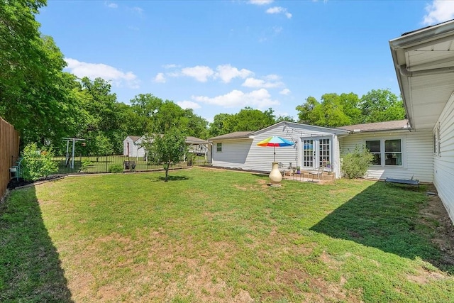view of yard featuring a patio area and a fenced backyard