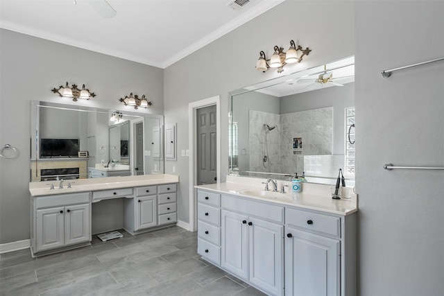 full bathroom with ornamental molding, a ceiling fan, walk in shower, and a sink