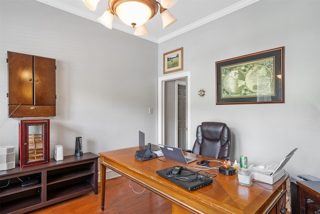 home office with crown molding and wood finished floors