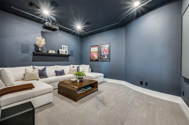 carpeted home theater room featuring baseboards