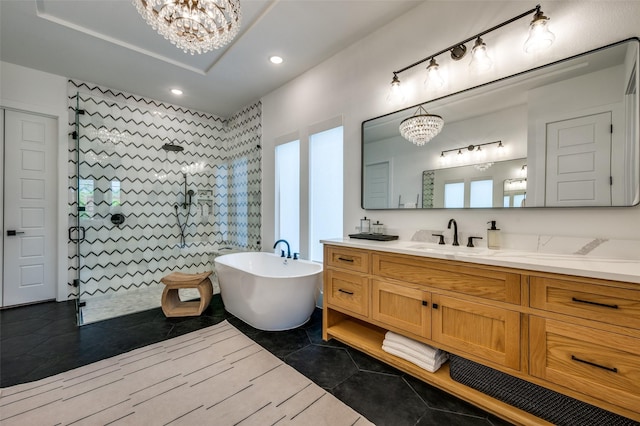 full bathroom featuring a chandelier, recessed lighting, a freestanding tub, a walk in shower, and vanity