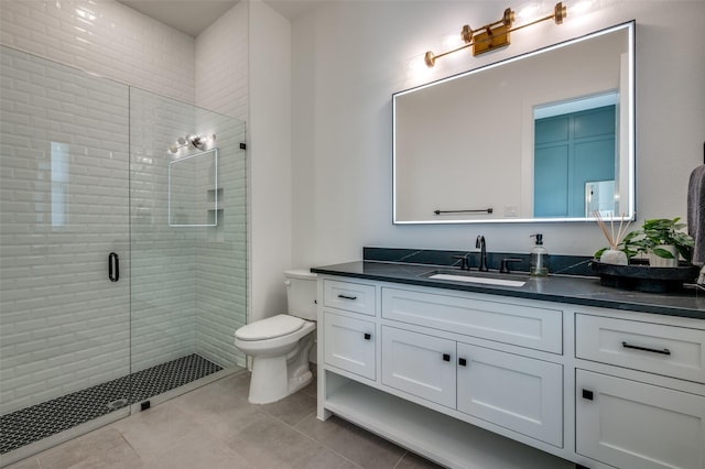 full bathroom with tile patterned floors, toilet, vanity, and a shower stall