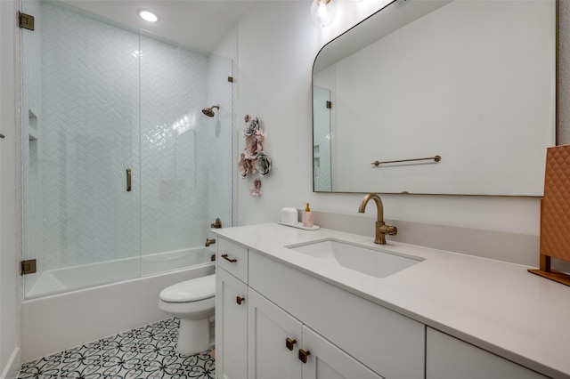bathroom featuring vanity, toilet, recessed lighting, and enclosed tub / shower combo