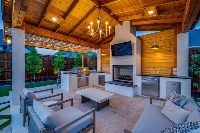 view of patio featuring an outdoor living space with a fireplace, a grill, exterior kitchen, and a fenced backyard