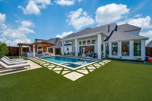 rear view of house featuring roof with shingles, an outdoor hangout area, and a fenced backyard