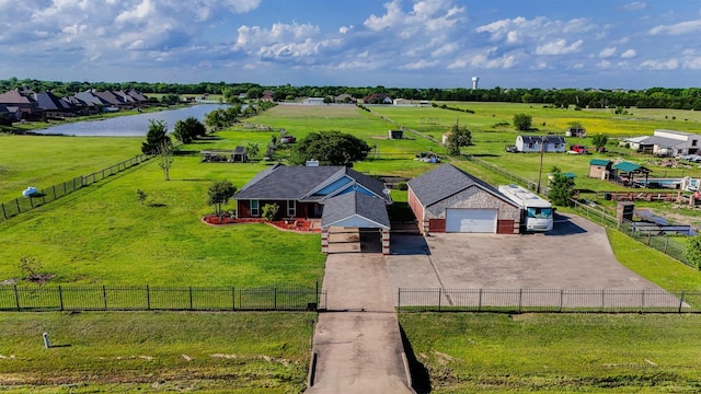 birds eye view of property featuring a rural view and a water view
