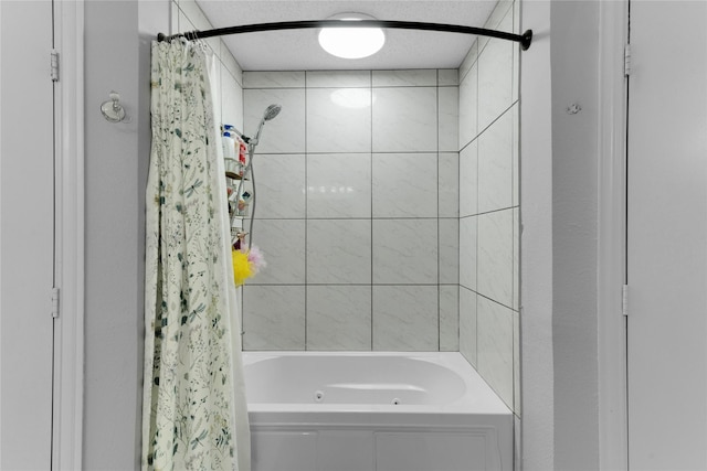 bathroom with shower / bath combo with shower curtain