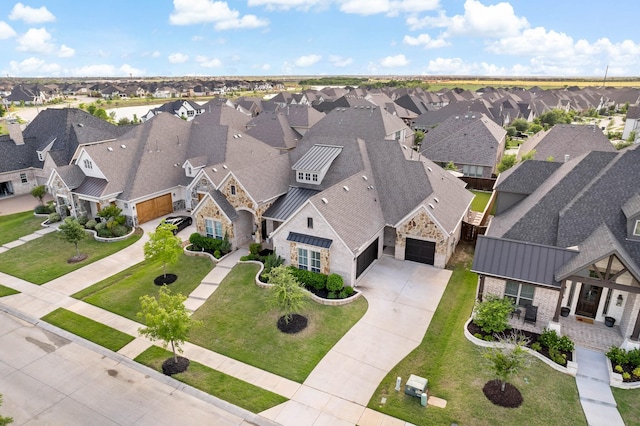 birds eye view of property with a residential view
