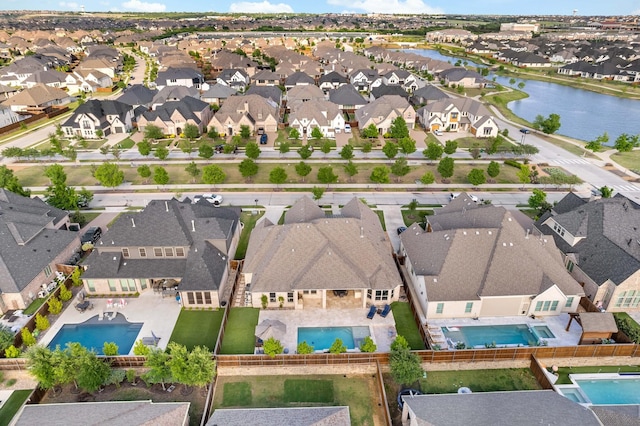 aerial view featuring a water view and a residential view