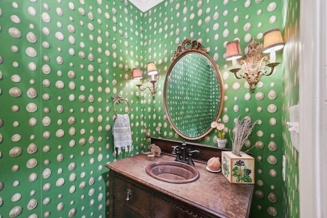 bathroom with an inviting chandelier and vanity