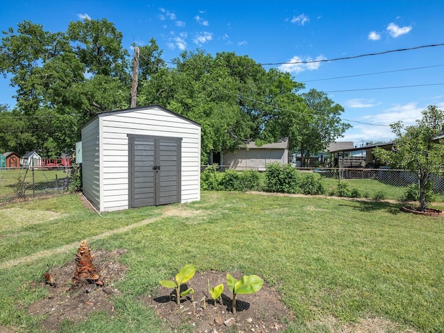 4451 Hardy St, Fort Worth, TX 76106 - view of yard featuring an outbuilding, a storage shed, and a fenced backyard