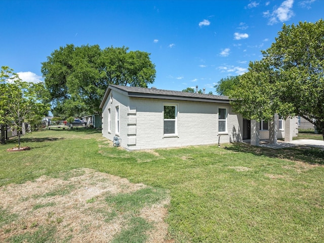 4451 Hardy St, Fort Worth, TX 76106 - exterior space featuring a yard and brick siding