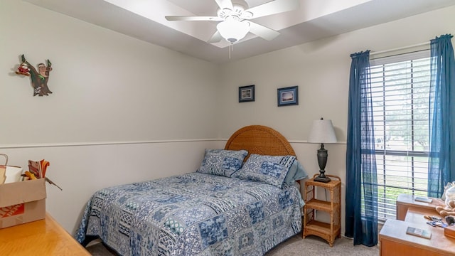 bedroom with light carpet and ceiling fan