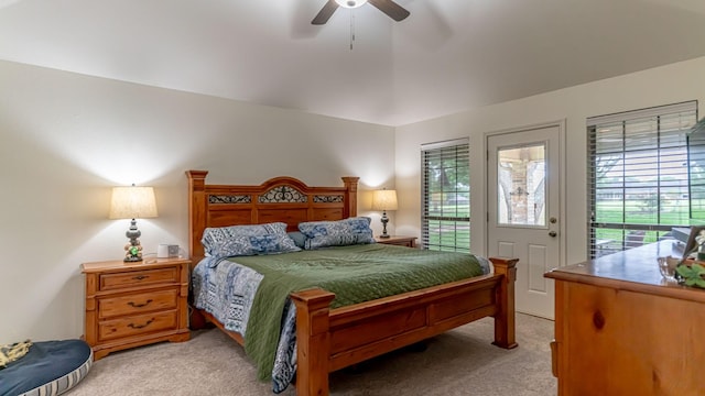 bedroom with access to outside, a ceiling fan, and light carpet