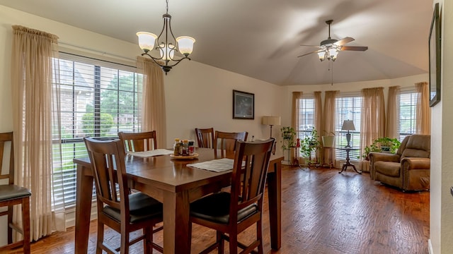 dining area featuring wood finished floors and ceiling fan with notable chandelier