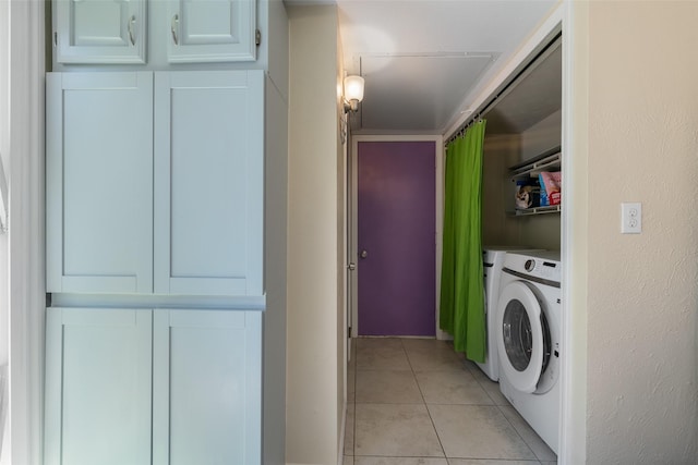 laundry area with light tile patterned floors, laundry area, and washer / clothes dryer