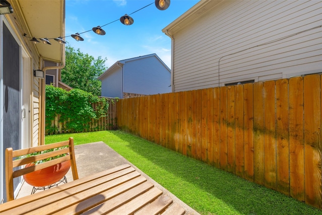 view of yard with a patio and a fenced backyard