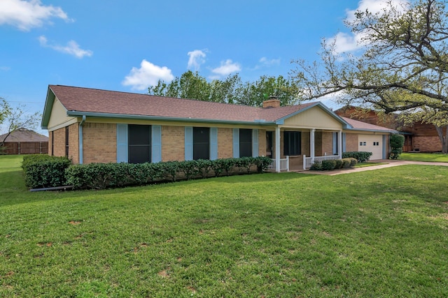 ranch-style home with a chimney, brick siding, a front lawn, and an attached garage