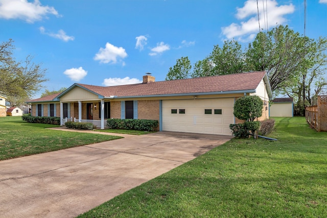 single story home featuring driveway, a chimney, covered porch, an attached garage, and a front lawn