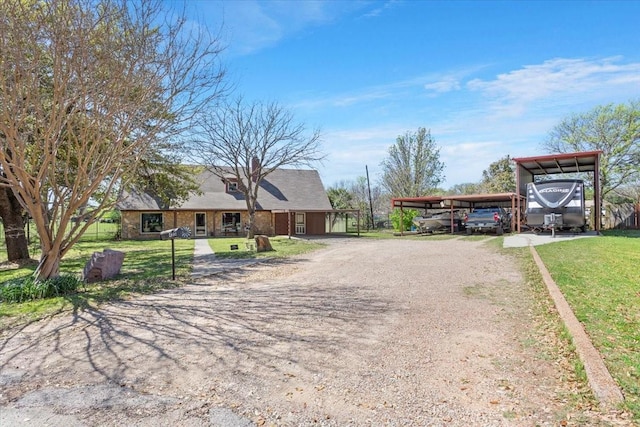 view of street with dirt driveway