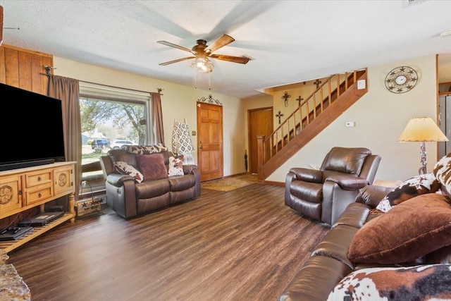living room featuring stairway, wood finished floors, and ceiling fan