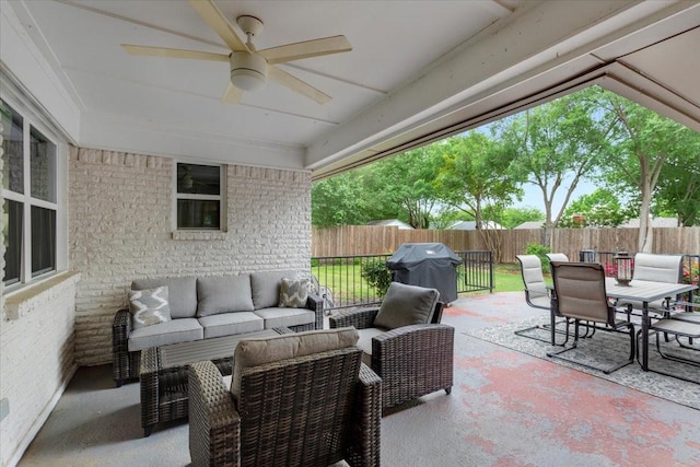 view of patio featuring a fenced backyard, grilling area, outdoor lounge area, outdoor dining space, and a ceiling fan