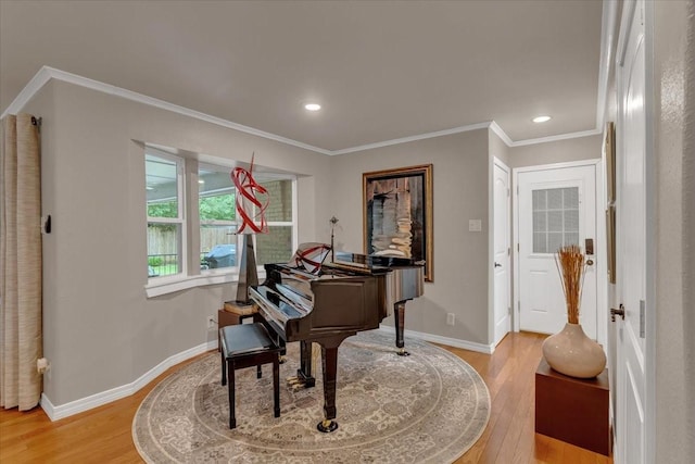 sitting room featuring crown molding, recessed lighting, baseboards, and light wood-style floors