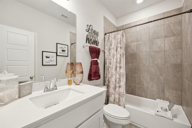 full bath featuring toilet, visible vents, shower / bathtub combination with curtain, and vanity