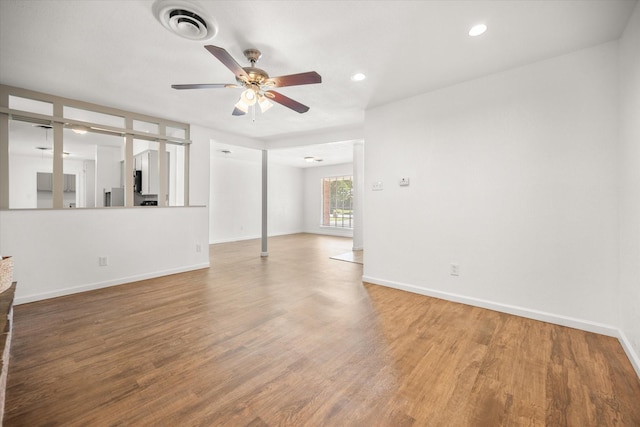 5816 Sandra Dr, Fort Worth, TX 76133 - unfurnished living room featuring visible vents, a ceiling fan, baseboards, and wood finished floors