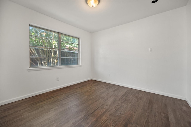 5816 Sandra Dr, Fort Worth, TX 76133 - empty room featuring baseboards and dark wood-style floors