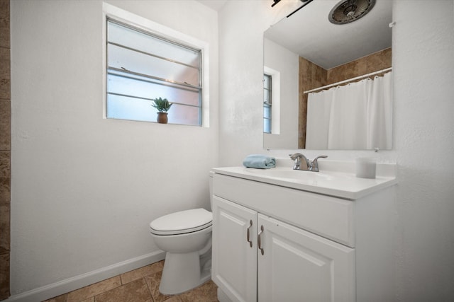 5816 Sandra Dr, Fort Worth, TX 76133 - full bath with vanity, plenty of natural light, baseboards, and toilet