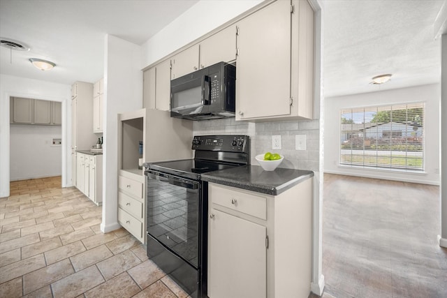5816 Sandra Dr, Fort Worth, TX 76133 - kitchen with dark countertops, baseboards, tasteful backsplash, visible vents, and black appliances