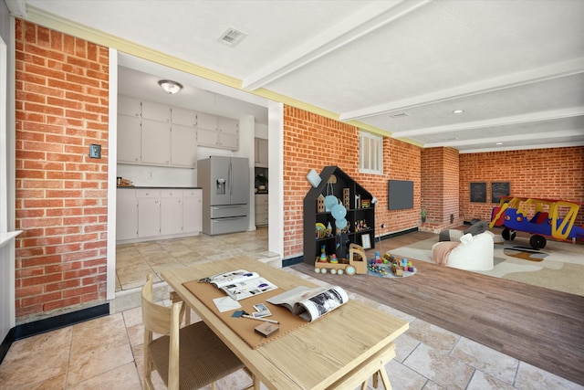 5816 Sandra Dr, Fort Worth, TX 76133 - interior space with stone tile floors, brick wall, visible vents, and beam ceiling