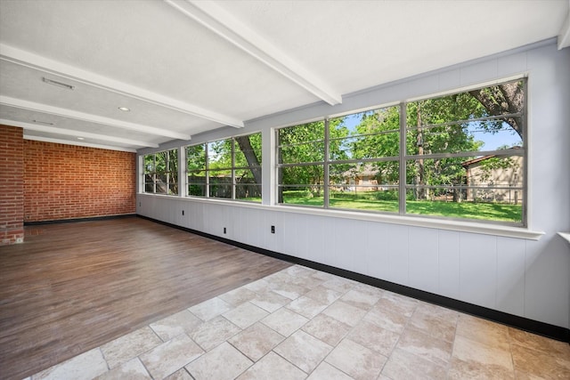 5816 Sandra Dr, Fort Worth, TX 76133 - unfurnished sunroom with beamed ceiling, a healthy amount of sunlight, and brick wall