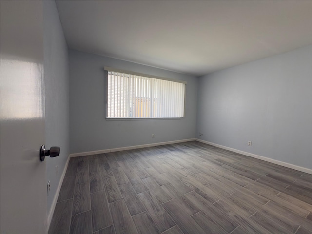 145 Trellis Pl, Richardson, TX 75081 - empty room with dark wood-style floors and baseboards