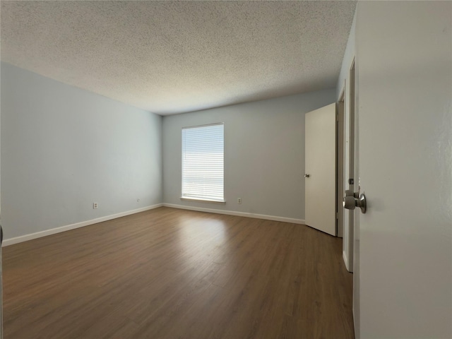 145 Trellis Pl, Richardson, TX 75081 - unfurnished room featuring wood finished floors, a textured ceiling, and baseboards