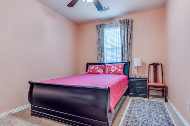 bedroom featuring baseboards, visible vents, a ceiling fan, and carpet flooring