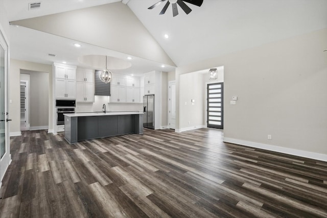 328 Brandon Way, Pottsboro, TX 75076 - kitchen with appliances with stainless steel finishes, a ceiling fan, white cabinetry, recessed lighting, and high vaulted ceiling