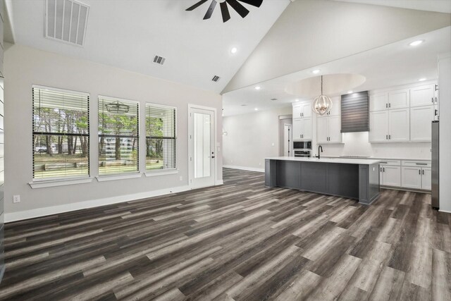 328 Brandon Way, Pottsboro, TX 75076 - kitchen featuring ceiling fan, high vaulted ceiling, light countertops, white cabinets, and a chandelier