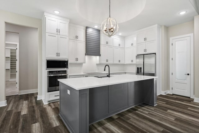 328 Brandon Way, Pottsboro, TX 75076 - kitchen featuring appliances with stainless steel finishes, a chandelier, white cabinets, light countertops, and dark wood-style floors