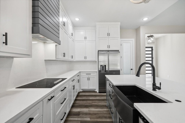 328 Brandon Way, Pottsboro, TX 75076 - kitchen with custom exhaust hood, black electric stovetop, stainless steel fridge with ice dispenser, white cabinets, and recessed lighting