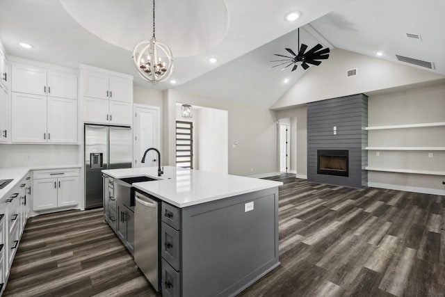 328 Brandon Way, Pottsboro, TX 75076 - kitchen featuring appliances with stainless steel finishes, gray cabinets, a large fireplace, a ceiling fan, and dark wood-style floors