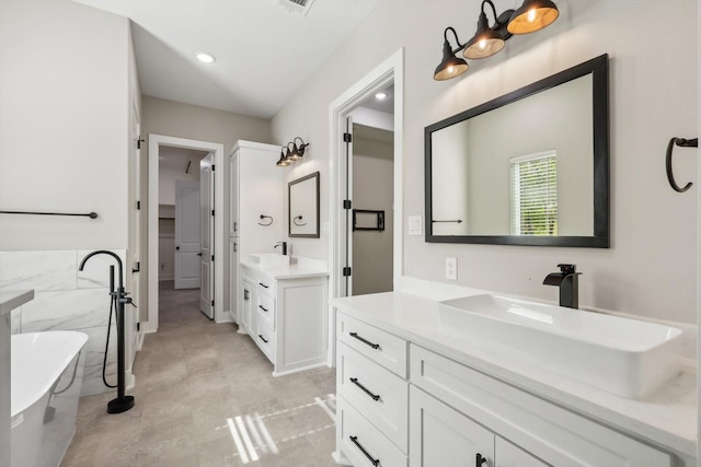 328 Brandon Way, Pottsboro, TX 75076 - bathroom with two vanities and a freestanding bath