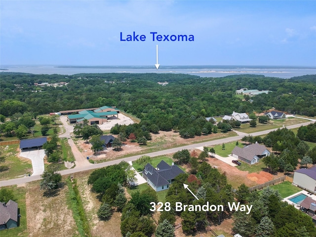 328 Brandon Way, Pottsboro, TX 75076 - aerial perspective of suburban area featuring a forest and a large body of water