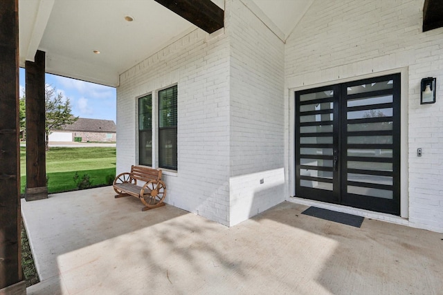 328 Brandon Way, Pottsboro, TX 75076 - entrance to property with french doors and brick siding