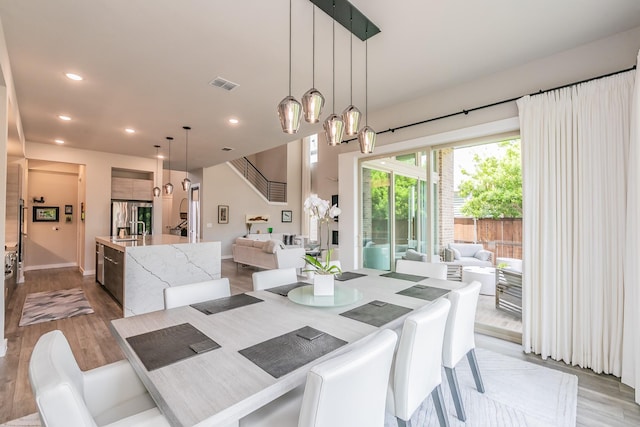 3901 Campania Ct, Colleyville, TX 76034 - dining area with visible vents, wood finished floors, a notable chandelier, and recessed lighting