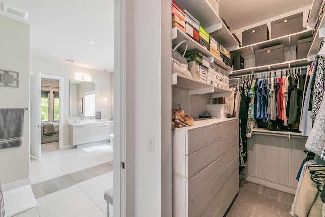 3901 Campania Ct, Colleyville, TX 76034 - walk in closet featuring light tile patterned floors and visible vents