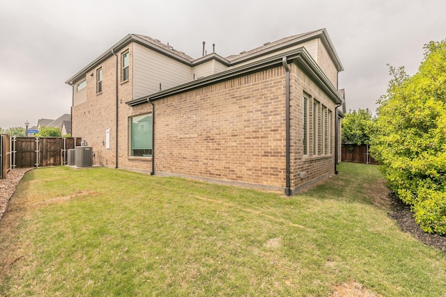 3901 Campania Ct, Colleyville, TX 76034 - rear view of house featuring a lawn, central air condition unit, brick siding, and a fenced backyard