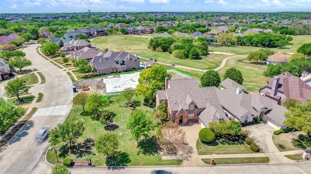 birds eye view of property featuring view of golf course and a residential view