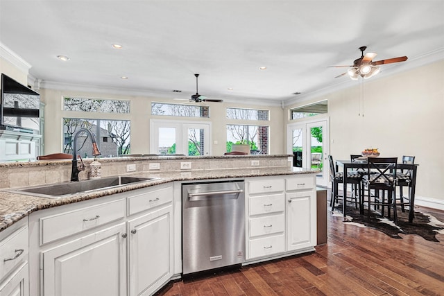 kitchen with stainless steel dishwasher, a ceiling fan, ornamental molding, dark wood-style floors, and a sink